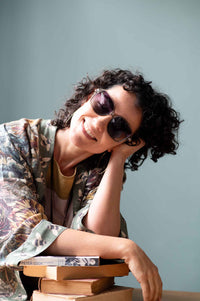 Woman in sunglasses and floral kimono