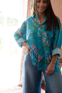 Ted Bluesette in floral shirt and denim jeans