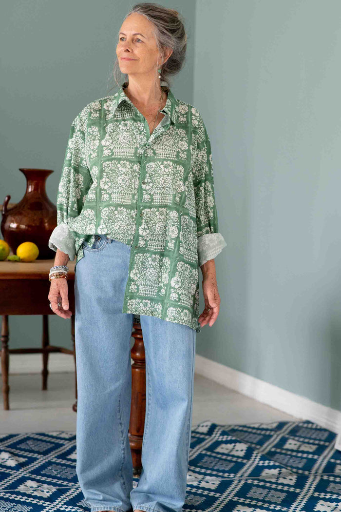 Woman in Ted shirt and Lucy jeans with flower basket background