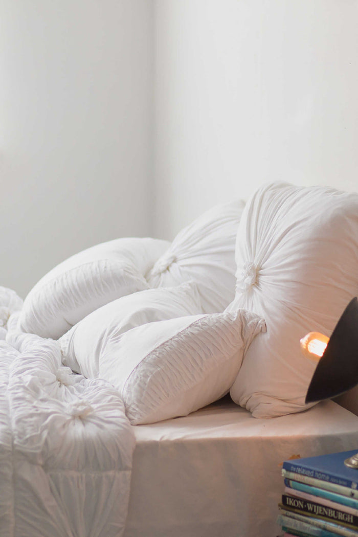 White Euro pillowcase set with white rosette quilt
