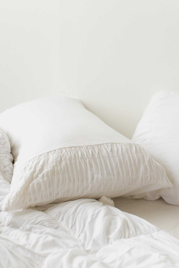 White rosette pillowcase set on bed