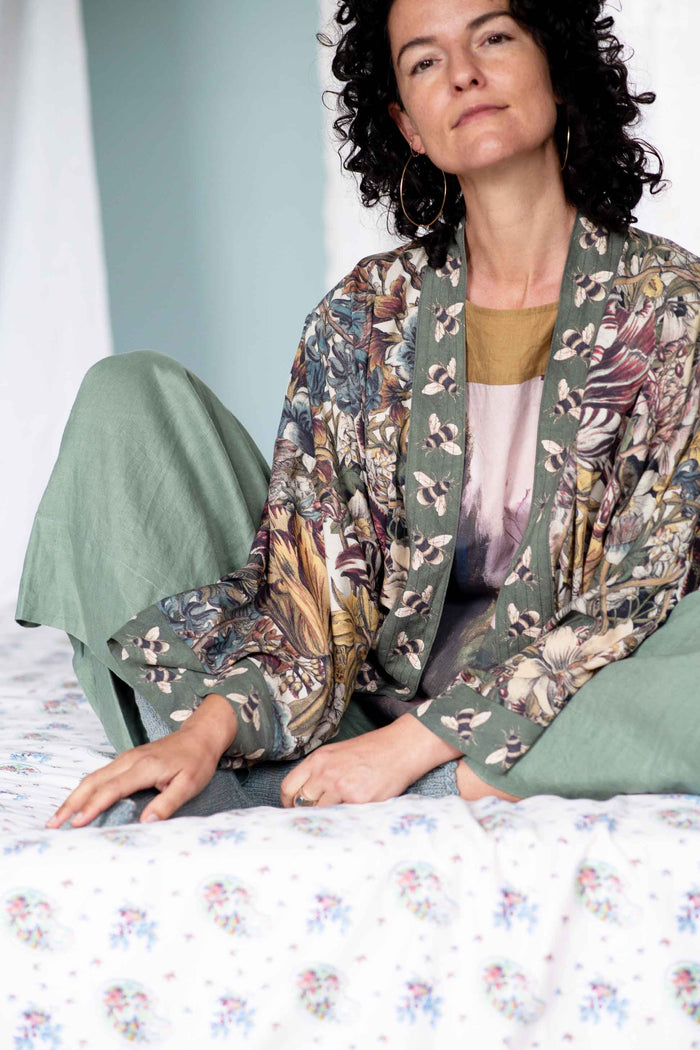 Peggy in green kimono in garden setting