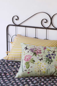 Busy Garden floral pillowcase set on bed