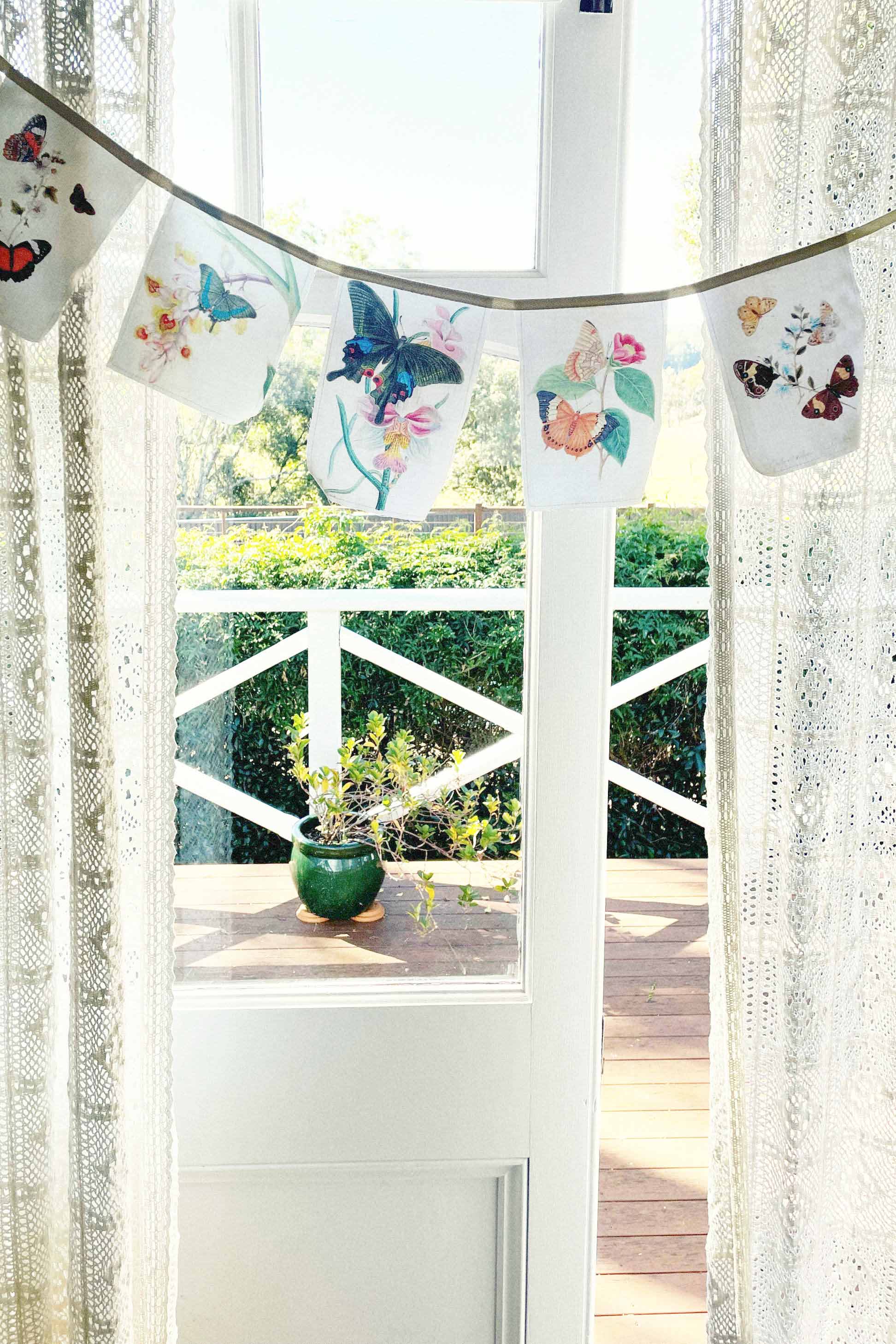 Butterfly garland hanging in window