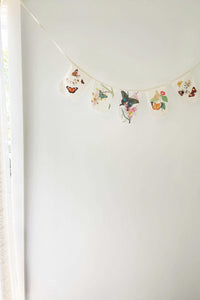 Butterfly garland on a white wall