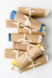 Garlands, various styles wrapped in paper and tied with ribbon.