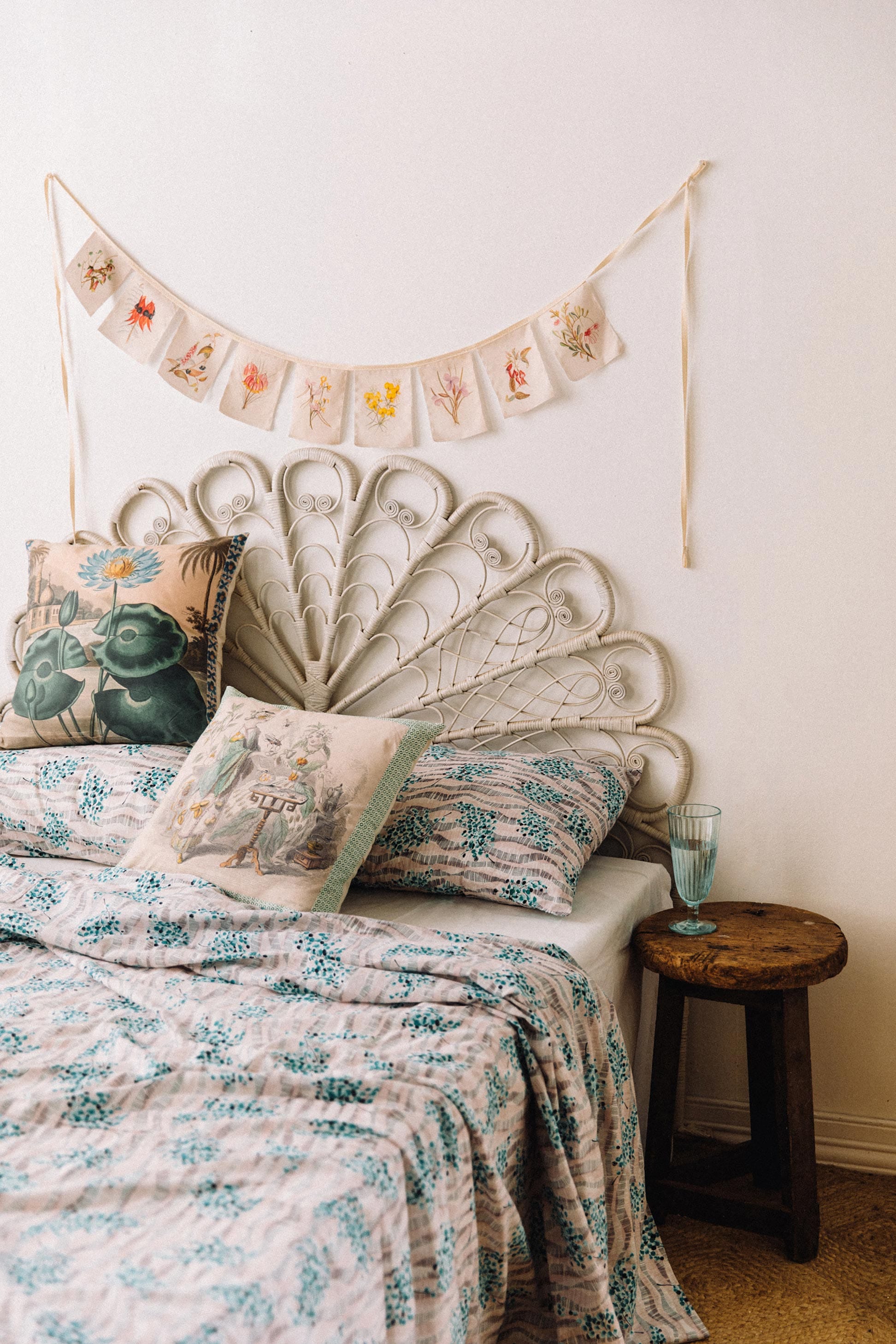 Summer top sheet, botanical cushions, garlands, & vintage tea decor
