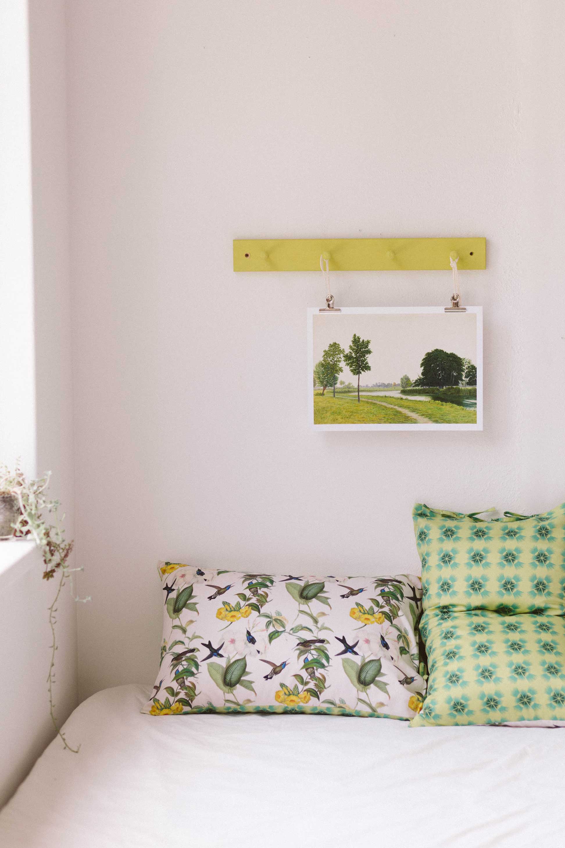 Hummingbird pillowcase set with tranquil park art print on bed