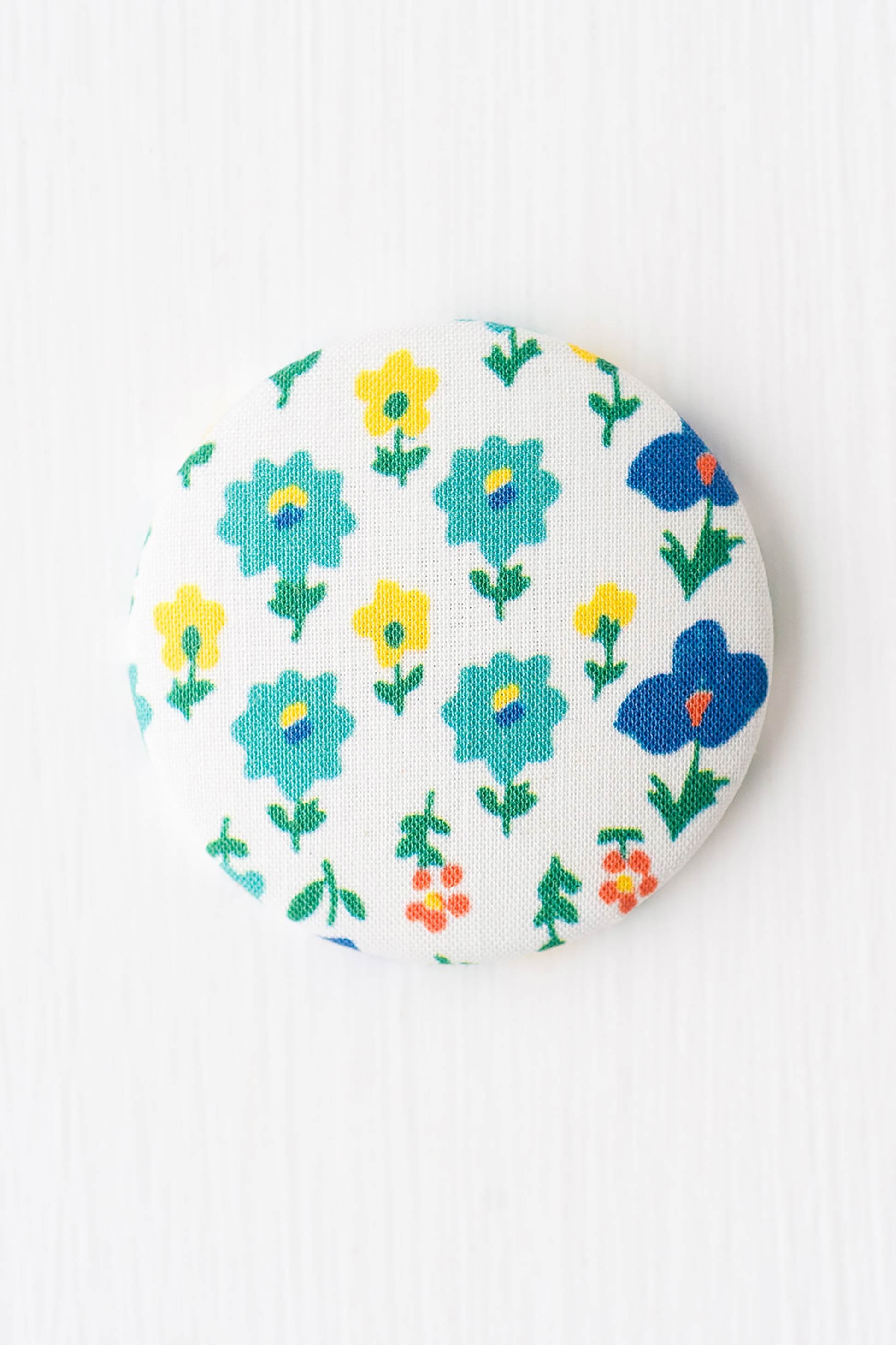 Magnet Mindy floral magnet with blue, yellow, and orange flowers
