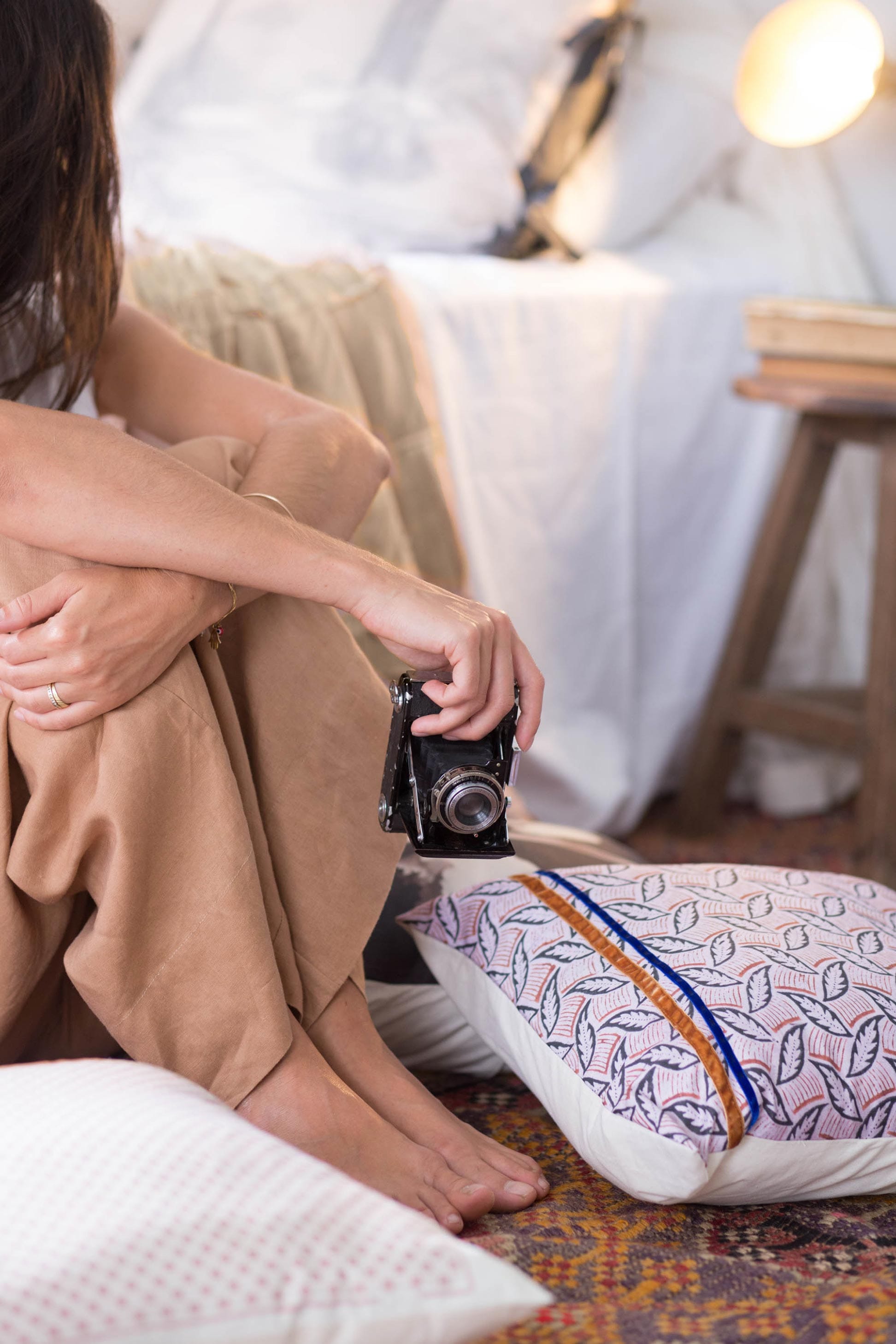 Woman with camera & OlliePant Macchiato leaf cushion cover