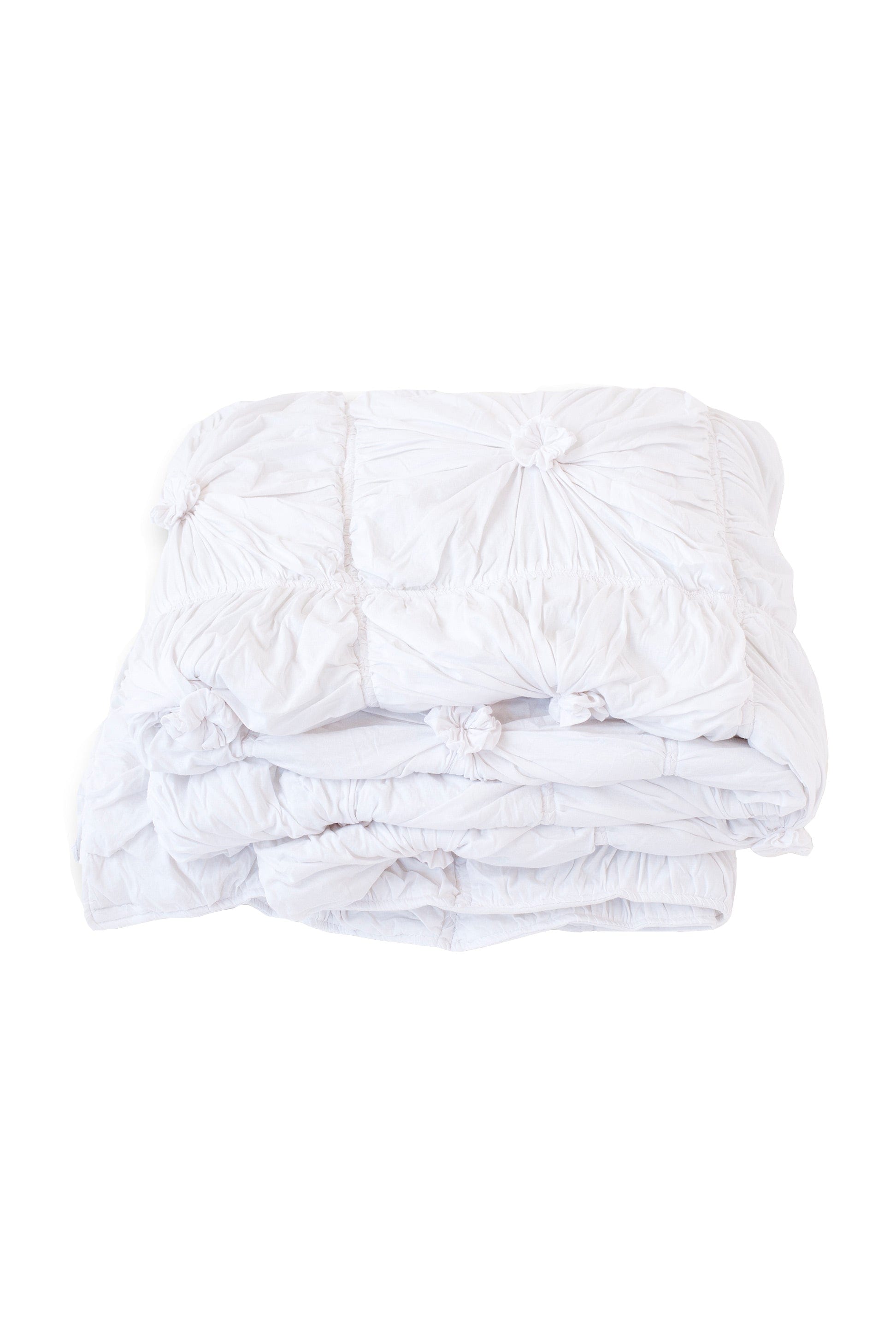 White quilt with textured design