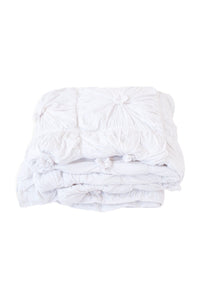 White quilt with textured design
