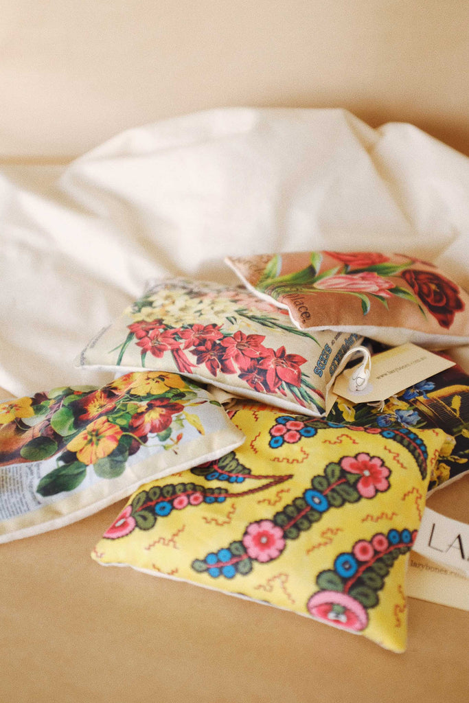 Pile of scented sachets with different vintage prints on them