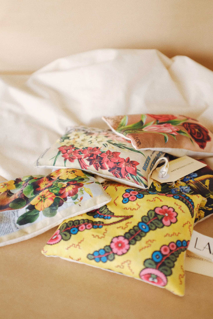 Pile of scented sachets with different vintage prints on them