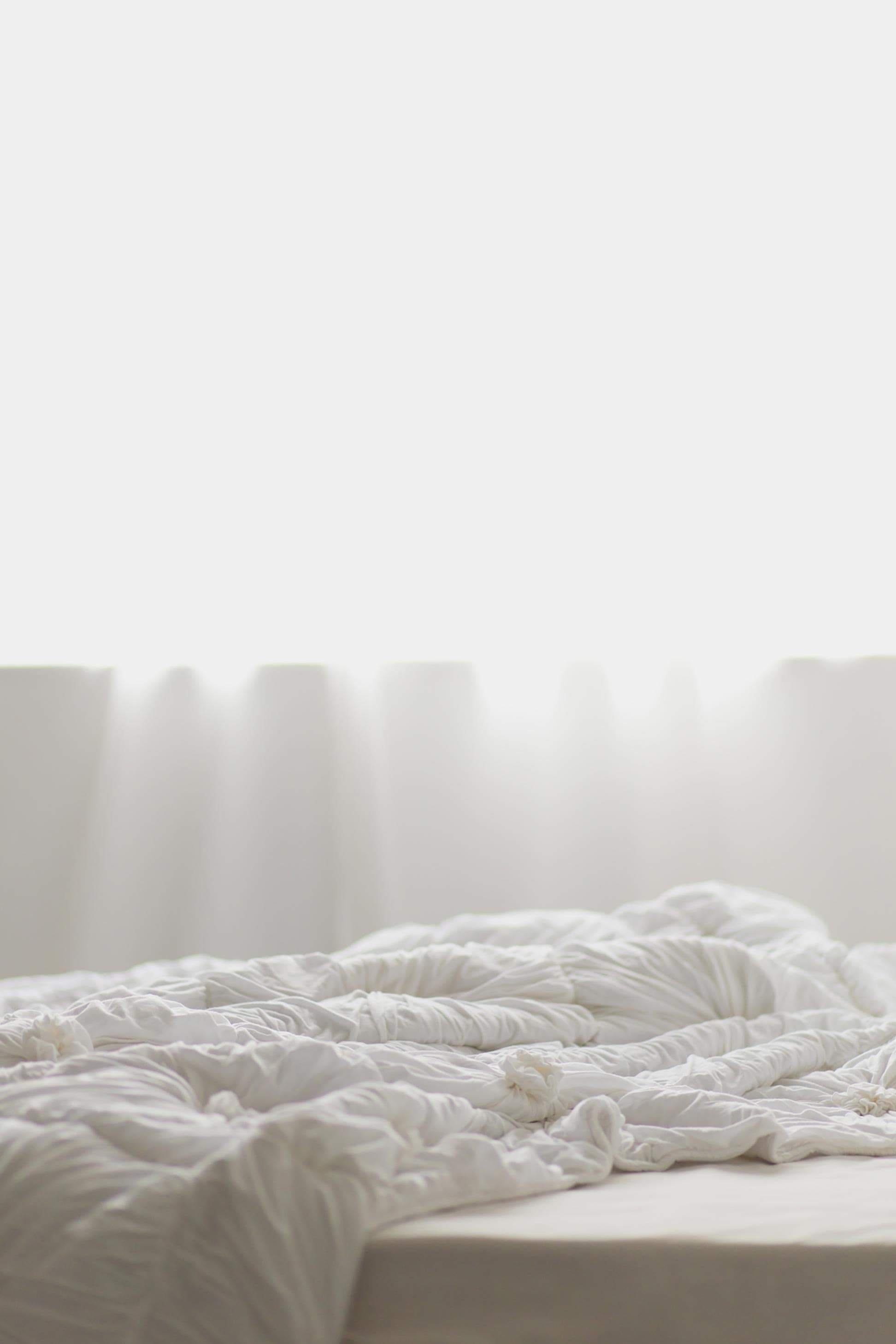 White rosette quilt on bed